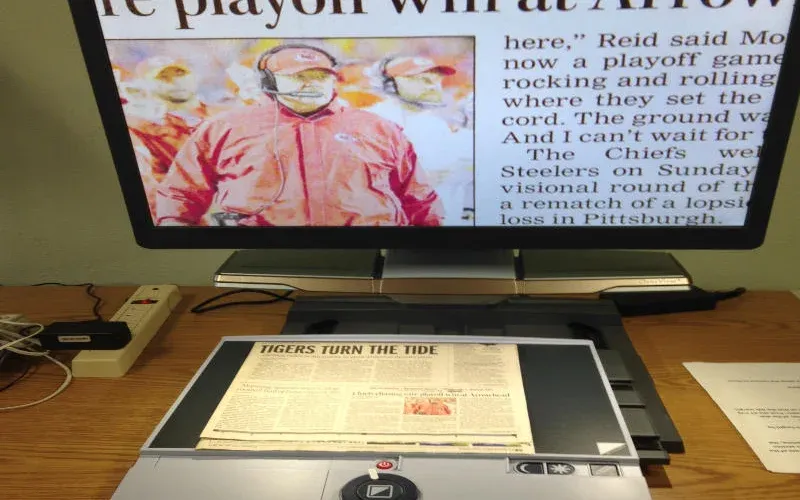 Digital magnifyer enlarges text for low vision assistance.